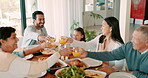 Thanksgiving toast with a big family of children, parents and grandparents eating food together for bonding in celebration. Love, brunch or cheers with kids and happy relatives in the dining room