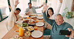 Selfie, wave and a family at thanksgiving dinner together for a celebration while eating food for bonding. Children, parents and grandparents on a video call at the dining room table during brunch
