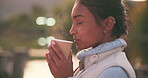 Profile, coffee and a woman hiking in nature, smelling fresh caffeine on a cold morning outdoor in the forest. Peace, quiet and a young person camping in the woods on a blurred background with tea