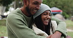 Love, romance or happy couple camping in nature enjoying holiday or vacation to relax together. View, smile or romantic man hugging, laughing or smiling with an `Indian woman on fun date outdoors