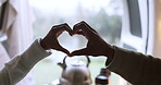 Heart hands, love and couple in a car for camping, road trip and holiday together in nature. Closeup, care and man and woman with an emoji gesture in transport during travel in a forest for vacation