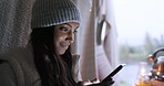 Smile, typing and a woman with a phone while camping for social media update, notification or chat. Happy, morning and a girl with a mobile on holiday in nature for connection and online network