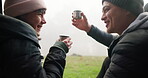 Cheers, camping and couple drinking coffee on a forest date, adventure and happy to travel together for love. Bonding, celebrate and people do a toast for quality time on outdoor holiday or vacation