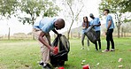 Diversity, group and volunteer in community service for recycling, cleaning pollution or waste in the park. People working together in teamwork, support or NGO for eco friendly environment in nature