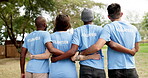 People, diversity and back in volunteer for community, teamwork or huddle in nature outdoors. Rear view of diverse group or team standing together in unity, collaboration or support trust in the park