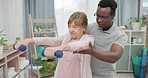 Physiotherapy, arms and senior woman with black man and dumbbell for body assessment. Physical therapy, weightlifting and elderly female with therapist for recovery, training and healing exercise