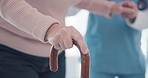 Nurse, disabled and old person hands with walking stick for support, elderly care or movement disability. Senior rehabilitation service, retirement home physiotherapy or worker help patient with cane