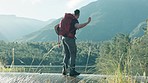 Throw, stone or man hiking by lake in nature adventure to explore outdoors for camping on holiday vacation. Traveller, or back of hiker with backpack playing on break or fun journey by river water 