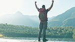 Success, hiking or man in celebration on mountain peak in nature adventure to explore outdoors journey. Traveller, view or back of excited hiker with hands up for hope or goal achievement in forest