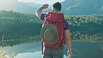 Walking, view or man hiking by lake in nature to explore outdoors for camping on holiday or adventure. Traveller, river water or hiker with backpack for travel, break or journey by mountains to relax