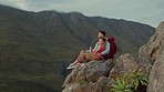 Hiking, mountains and view, couple relax on outdoor adventure and peace in nature with romance. Trekking, climbing and love, man and woman with view of natural landscape sitting on rocks together.