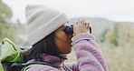 Binoculars, nature or woman hiking on travel journey, jungle adventure or holiday vacation to explore. Sightseeing, hiker on search or traveler trekking in woods looking or  bird watching outdoors