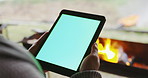 Person, campfire or hands with mockup on tablet for communication, networking or browsing outdoors. Bonfire, space or camper with technology on user or ux display with chroma key or green screen