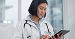 Woman, doctor and tablet for healthcare search, typing and clinic or hospital software, telehealth or research. Office, online charts or report of medical professional or asian person on digital tech