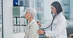 Elderly woman, doctor and stethoscope on back to listen to lungs for breathing problem. Senior, medical professional and person with cardiology tools for exam, consultation and healthcare in hospital