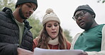 Hiking, forest and lost people with map, documents guide and location information for nature travel or journey. Young friends, woman and men planning and search paper for direction in park or woods