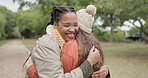 Hug, happy and friends in nature for communication, love or care on the weekend together. Smile, positive and diversity with women in a park for conversation, missing and embrace for friendship