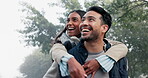 Love, couple and piggy back in the nature with a smile, happy date or people together for fun in the park, woods or walk in forest. Friends, Indian woman and man have quality time to play on vacation