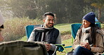 Friends, camping and talking together in happy conversation, quality time or smile on holiday, vacation or bonding in nature. Camp, people and relax with happiness in woods, forest or bonfire