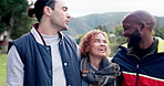 Camping, forest and funny group of friends laughing and happy for outdoor holiday or vacation trip together. Travel, talking and people in conversation chilling in the woods for an adventure 