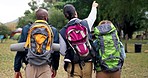 Hiking, pointing and backpack in nature with view and walking on travel and holiday. Vacation, adventure and happy with journey and adventure of young people and friends with freedom and back