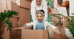 Girl, playing and father in cardboard at real estate for entertainment at new home for investment. Kid, happiness and parent in box at property for celebration with game with freedom or energy.