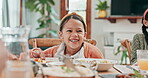 Kid, laughing and girl at table for lunch for bonding in home with happiness or meal for nutrition. Happy, face and child with food for dinner or having fun together in house with conversation.