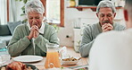 Senior couple, home and praying for food at dinner table together with big family. Happy man, woman and people in worship, prayer and thanks for eating lunch meal, respect or gratitude in dining room