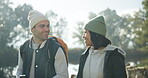 Walking woman, man or talking in camping nature for trip, bonding or travel in winter countryside. Smile, happy or interracial couple in conversation for morning holiday, vacation or hiking adventure
