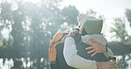 Woman, man and hug in nature for camping trip, bonding and travel in winter countryside. Smile, happy or interracial couple in embrace for morning holiday, vacation or forest hiking adventure by lake