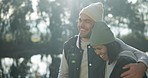 Woman, man or walking hug in camping nature for trip, bonding or travel in winter countryside. Smile, talking or interracial couple in embrace for morning holiday, vacation or forest hiking adventure