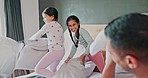Playful, bedroom and a happy family pillow fight, bonding and together for fun in the morning. Care, playful and young and comic parents with children on the bed for games, funny and excited