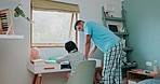 Talking, morning and a father and child with homework help, learning and education from a house. Family, happy and a dad with support for a kid doing a project, writing or studying in a room