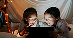 Tablet, girl children or sisters reading in a bedroom tent for storytelling or bonding together at night. Technology, family or love with female sibling kids lying on the floor in the home at bedtime