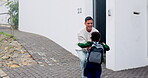 Arrive home, girl student hugging her father outdoor after school education or learning for child development. Family, love and a happy female kid running to greet her parent at the door of a house