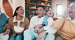 Family, laugh and popcorn on sofa for movie, watching tv and relax together with grandparents, parents and kid. Mom, dad and girl child with funny comedy, comic television show and happy in lounge