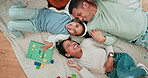 Family, playing and laughing together at home to relax, bond and quality time. A happy man, woman or parents tickle a young girl or child on the floor with happiness, love and toys from above