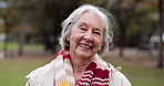 Portrait, senior woman and smile in the park with happiness in nature, woods or outdoor for a walk in retirement. Happy, face and elderly person with wellness from exercise or healthy workout