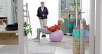 Senior woman, exercise ball and personal trainer in home, tablet or app for training advice, workout or health. Elderly lady, dumbbells or fitness coach for chat, motivation or support in retirement