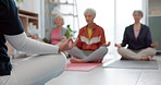 Senior people, yoga class and coach meditation, lotus and peace hands for exercise, holistic wellness and mindfulness. Spiritual workout, group and calm elderly women, clients and personal trainer