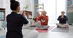 Senior women, yoga class and coach in meditation, lotus and prayer hands for exercise, holistic wellness and stretching. Workout, peace and calm of elderly people, clients and zen personal trainer