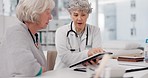 Senior doctor, tablet and discussion with patient for healthcare prescription or diagnosis at hospital. Mature medical professional talking to elderly female person on technology for consultation