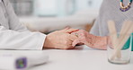 Senior woman, doctor and holding hands with patient in elderly care, love or consultation at the hospital. Closeup of medical professional touching hand for healthcare trust, support or appointment