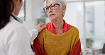 Healthcare, shoulder pain and a senior woman with her doctor in the hospital, talking during a consultation. Medical, insurance or anatomy and a woman patient in a clinic with a medicine professional