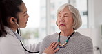 Woman, doctor and listening for patient heart beat in checkup, appointment or consultation at hospital. Medical healthcare expert examining elderly customer in cardiology with stethoscope at clinic