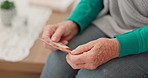 Senior woman, hands and photograph of memory, past or thinking of personal history in home, living room or retirement. Zoom, hand and person with photo, picture or record of life, family or friends