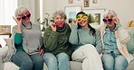 Happy, glasses and senior women face on the living room sofa for fun, playing and comedy. Smile, laughing and portrait of elderly friends or people with sunglasses, bonding and comic on the couch