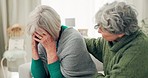 Empathy, sad and senior woman crying for loss, grief or depression in the living room at home. Mental health, emotions and elderly female person comforting her friend in sorrow for sympathy in house.