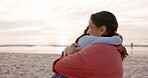 Beach, mother and child hug outdoor on family vacation, holiday or adventure at sunset. Woman and a happy girl kid embrace at ocean for quality time with love, comfort and care or support in nature