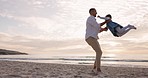 Family, beach and father spin child outdoor on vacation, holiday or adventure at sunset. Girl kid running to a man or dad while playing together at ocean for quality time and fun energy in nature